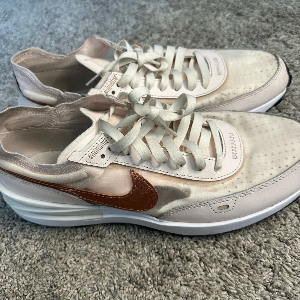 Nike Women's Sneakers in White with Metallic Rose Gold Swoosh